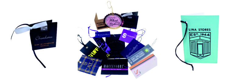 A selection of paper and card gift tags printed with customers details and string or ribbon ties